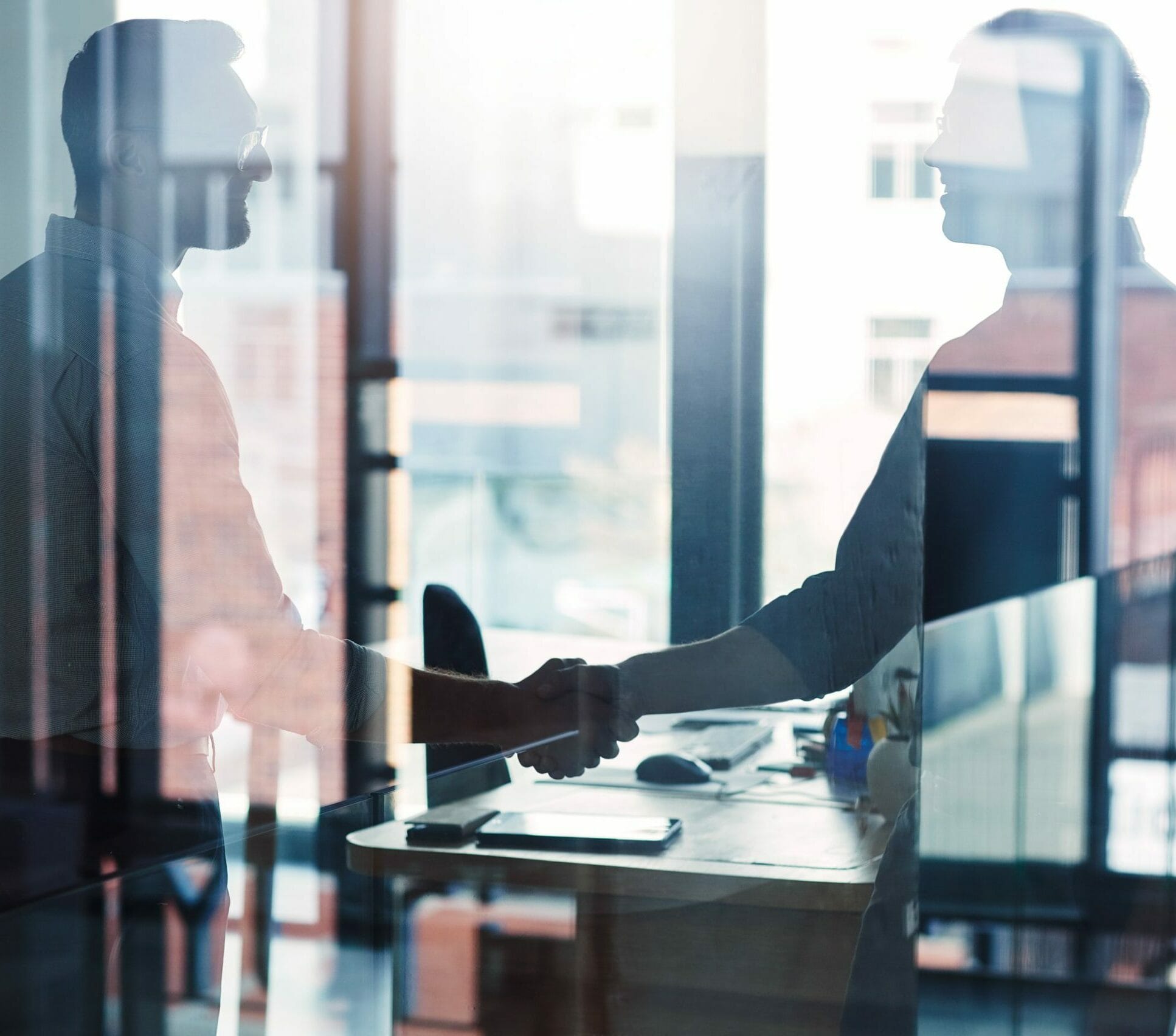 blurred-image-2-people-office-handshake-scaled-e1694528027165.jpg?w=1024&h=902&scale